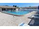 Community pool with lounge chairs surrounding it and a clear blue swimming pool at 24862 Us Highway 19 N # 2801, Clearwater, FL 33763