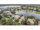 Picturesque neighborhood featuring gorgeous houses surrounding a tranquil lake at 2665 Lakebreeze N Ln, Clearwater, FL 33759