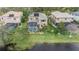 Aerial view showcases the home's pool, landscaping, and proximity to the water at 2665 Lakebreeze N Ln, Clearwater, FL 33759