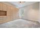 Empty bedroom with neutral walls, wall-to-wall wardrobe, and one window at 2665 Lakebreeze N Ln, Clearwater, FL 33759