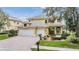 Charming two-story home with a three-car garage and well-maintained landscaping at 2665 Lakebreeze N Ln, Clearwater, FL 33759
