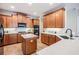 Well-equipped kitchen with stainless steel appliances, granite countertops, and plenty of cabinet storage space at 2665 Lakebreeze N Ln, Clearwater, FL 33759