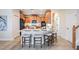 Bright kitchen features a large island with seating, stainless steel appliances, and ample cabinet space at 2665 Lakebreeze N Ln, Clearwater, FL 33759