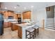 Spacious kitchen featuring granite countertops, wooden cabinetry, and stainless steel appliances at 2665 Lakebreeze N Ln, Clearwater, FL 33759
