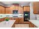 Well-designed kitchen featuring granite countertops, stainless steel appliances, and plenty of storage space at 2665 Lakebreeze N Ln, Clearwater, FL 33759