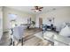 Bright living room area with hardwood floor, with a foosball table and modern furnishings at 2665 Lakebreeze N Ln, Clearwater, FL 33759