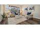 Cozy living room with large windows and modern furnishings, offering a relaxing atmosphere at 2665 Lakebreeze N Ln, Clearwater, FL 33759
