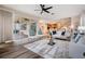 Open-concept living room with comfortable seating, modern decor, and easy access to outdoor patio at 2665 Lakebreeze N Ln, Clearwater, FL 33759