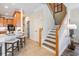 Elegant staircase with wooden handrail and tiled flooring, leading to the upper level at 2665 Lakebreeze N Ln, Clearwater, FL 33759