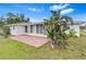 An outdoor patio is the perfect spot for relaxing and entertaining at 269 Algiers Dr, Venice, FL 34293