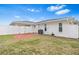Backyard showing a brick patio enclosed by a white vinyl fence at 269 Algiers Dr, Venice, FL 34293