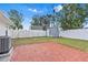 Fenced backyard featuring a brick patio and a shed at 269 Algiers Dr, Venice, FL 34293