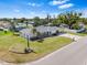 Charming single-story home with a well-manicured lawn and a classic brick accent wall at 269 Algiers Dr, Venice, FL 34293