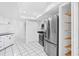 Efficient kitchen with stainless steel appliances, pantry, and white cabinetry, perfect for modern cooking and storage at 269 Algiers Dr, Venice, FL 34293