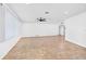 Spacious living room featuring a ceiling fan, recessed lighting, and tile flooring, offering a modern and functional space at 269 Algiers Dr, Venice, FL 34293
