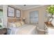 Cozy bedroom features a queen bed, artwork, and neutral tones at 29845 Imperati Blvd, Wesley Chapel, FL 33543