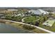 Beautiful outdoor community area including a pool, a putting green, and a bocce ball court by the water at 29845 Imperati Blvd, Wesley Chapel, FL 33543