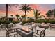 Outdoor seating area with modern fire pits, ideal for evening gatherings in a lush setting at 29845 Imperati Blvd, Wesley Chapel, FL 33543