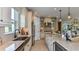 Well-lit kitchen boasts stainless steel appliances, a spacious island, and stylish backsplash at 29845 Imperati Blvd, Wesley Chapel, FL 33543
