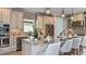 Gourmet kitchen showcases a large center island, modern appliances, and ample counter space at 29845 Imperati Blvd, Wesley Chapel, FL 33543