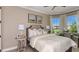 Bright bedroom boasting neutral decor, and large windows with neighborhood views at 29845 Imperati Blvd, Wesley Chapel, FL 33543