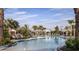 Large community pool featuring fountains, lounge chairs, umbrellas and beautiful landscaping at 29845 Imperati Blvd, Wesley Chapel, FL 33543