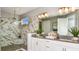 Modern bathroom with marble-style tile shower and dual sinks at 29863 Imperati Blvd, Wesley Chapel, FL 33543