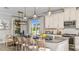 Beautiful kitchen with stainless steel appliances, ample countertop space, and seating for guests at 29863 Imperati Blvd, Wesley Chapel, FL 33543
