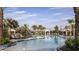 Relax by the community pool with lounge chairs, palm trees, and inviting cabanas at 29863 Imperati Blvd, Wesley Chapel, FL 33543