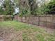 Spacious backyard enclosed by a wooden fence, offering privacy and potential for outdoor enjoyment at 3112 E 8Th Ave, Tampa, FL 33605