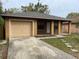 Inviting single-story home with attached garage and well-maintained front yard in a suburban neighborhood at 3112 E 8Th Ave, Tampa, FL 33605
