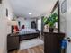 Bedroom showcasing a wood floor, a bed with drawer storage, and a comfortable and inviting atmosphere at 3358 Tanglewood Trl, Palm Harbor, FL 34685