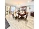 Chic dining room with stylish chandelier, decorative shelving, and an inviting ambiance at 3358 Tanglewood Trl, Palm Harbor, FL 34685