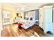 Cozy main bedroom features wood floors, accent wall, and modern furniture at 3358 Tanglewood Trl, Palm Harbor, FL 34685