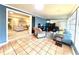 Cozy sun room with tile flooring, a sitting area, and views to the main living room at 3358 Tanglewood Trl, Palm Harbor, FL 34685
