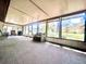 Spacious sunroom with neutral carpet, large windows and great natural light at 3358 Tanglewood Trl, Palm Harbor, FL 34685