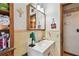 Modest bathroom featuring a single sink vanity, medicine cabinet, and light fixtures at 4002 W Gray St, Tampa, FL 33609