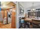 Cozy dining area featuring a wooden table, chairs, and an adjacent view into the kitchen at 4002 W Gray St, Tampa, FL 33609