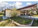 A cozy single-story home with a covered carport and small garden at 4002 W Gray St, Tampa, FL 33609