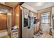 Functional kitchen with wood cabinets, stainless steel refrigerator, and an exterior door at 4002 W Gray St, Tampa, FL 33609