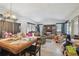Spacious living room with fireplace, multiple windows, and connected dining area at 4002 W Gray St, Tampa, FL 33609
