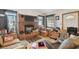 Inviting living room features a brick fireplace and a neutral color scheme, full of boxes and other personal items at 4002 W Gray St, Tampa, FL 33609