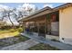 Covered patio with seating area, perfect for outdoor dining and entertaining at 4002 W Gray St, Tampa, FL 33609