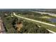 A bird's eye view of lush greenery, local waterways and a nearby highway making commuting easy at 4535 Kennewick Pl, Riverview, FL 33578