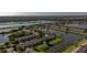 Scenic aerial view of a lakeside townhome community, nestled among trees and waterways at 4535 Kennewick Pl, Riverview, FL 33578