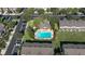 Aerial view of the community pool, clubhouse, parking and surrounding landscaping at 4535 Kennewick Pl, Riverview, FL 33578
