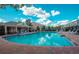 Community pool surrounded by lounge chairs, with a covered pavilion at 4535 Kennewick Pl, Riverview, FL 33578