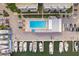 Aerial view of a waterfront condo community with a boat dock, pool, and parking area at 4904 38Th S Way # 316, St Petersburg, FL 33711