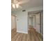 Bedroom with wood-look flooring, multiple closets, and neutral paint at 4904 38Th S Way # 316, St Petersburg, FL 33711