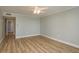 Clean bedroom featuring luxury vinyl plank flooring, neutral paint, and a closet at 4904 38Th S Way # 316, St Petersburg, FL 33711